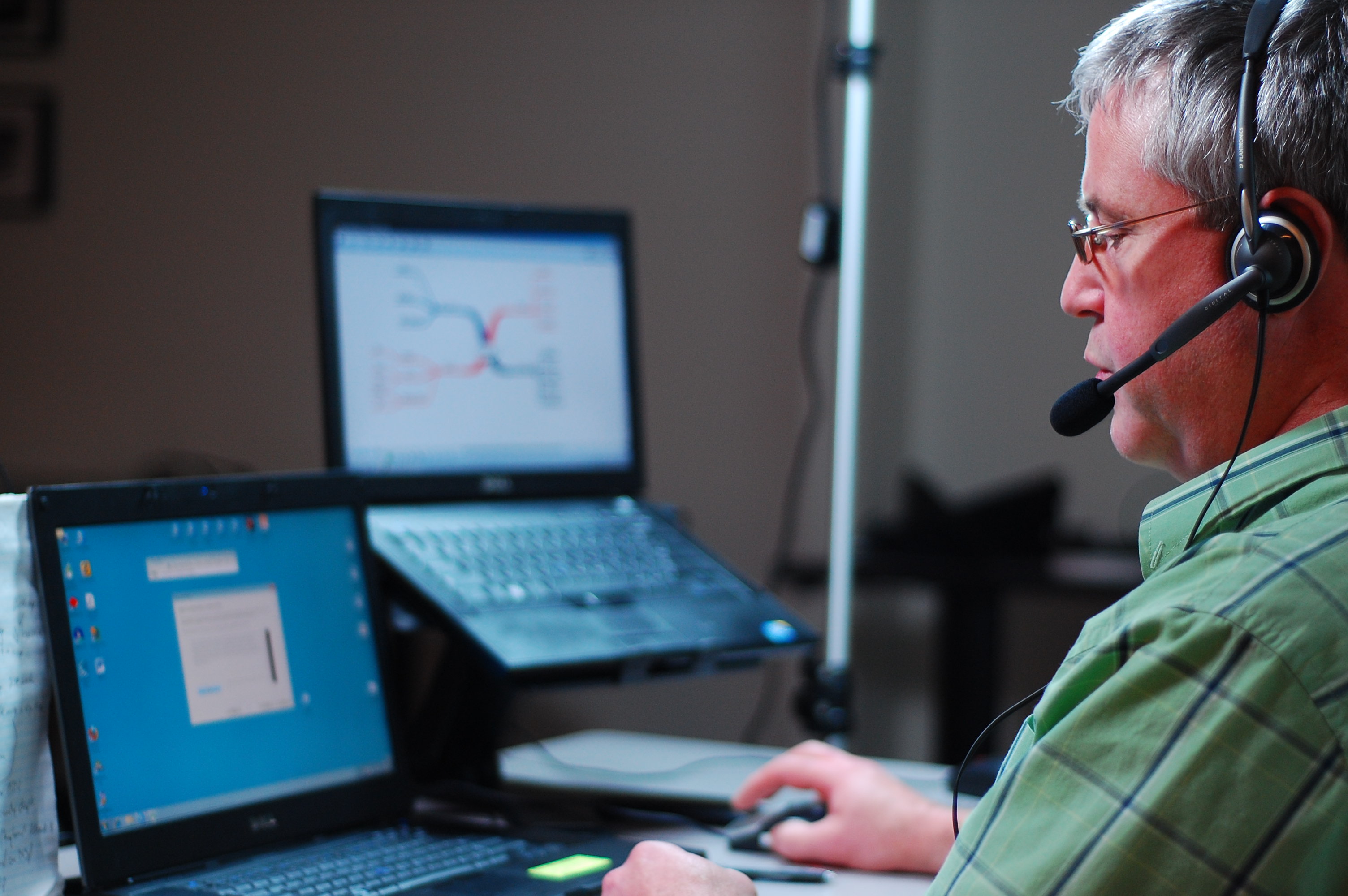 Photo of an ATBC consultant demonstrating assistive technology